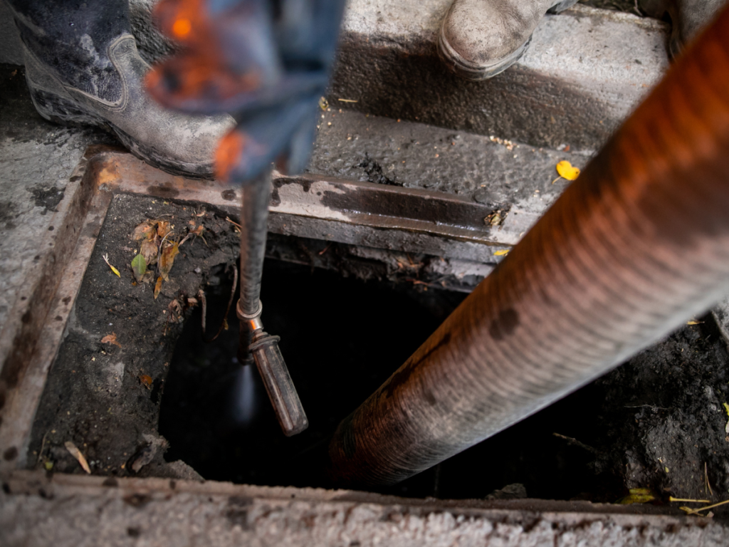 cleaning the storm drain inlet